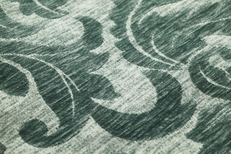 Green patterned fabric with a soft texture